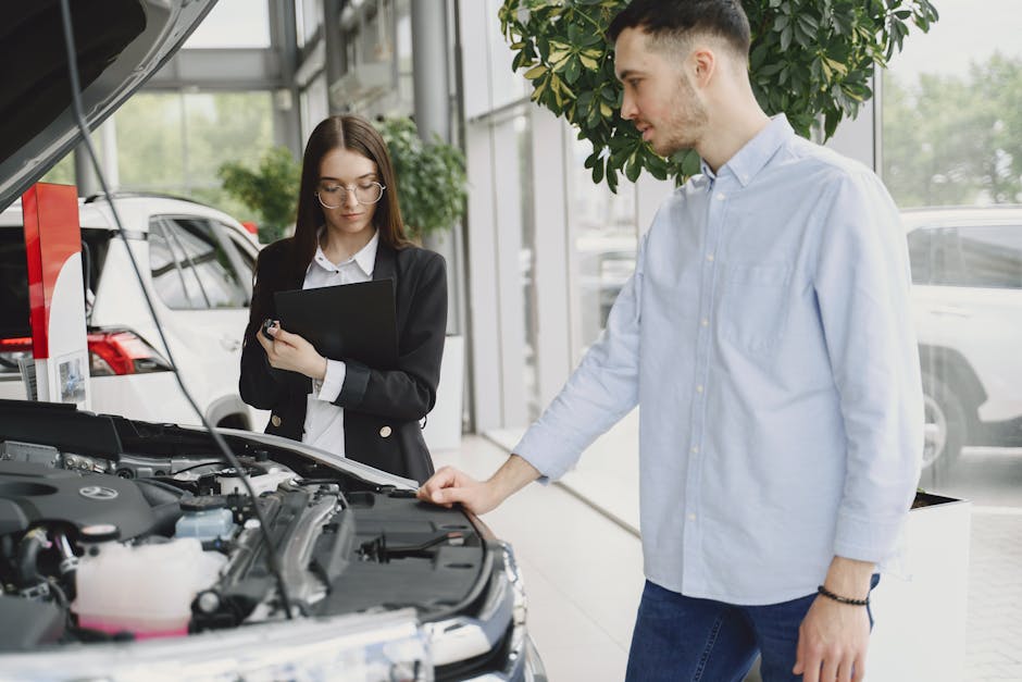 Mechanic talking to a customer about their vehicle's tires